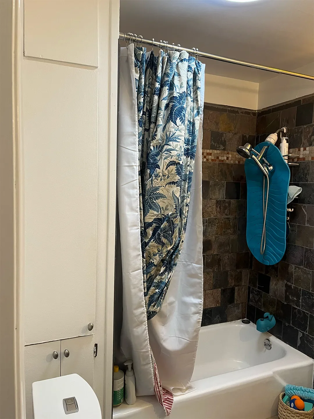 Before & After: Evicting a Cabinet Unlocked This L.A. Bathroom’s Wild Striped Shower Moment
