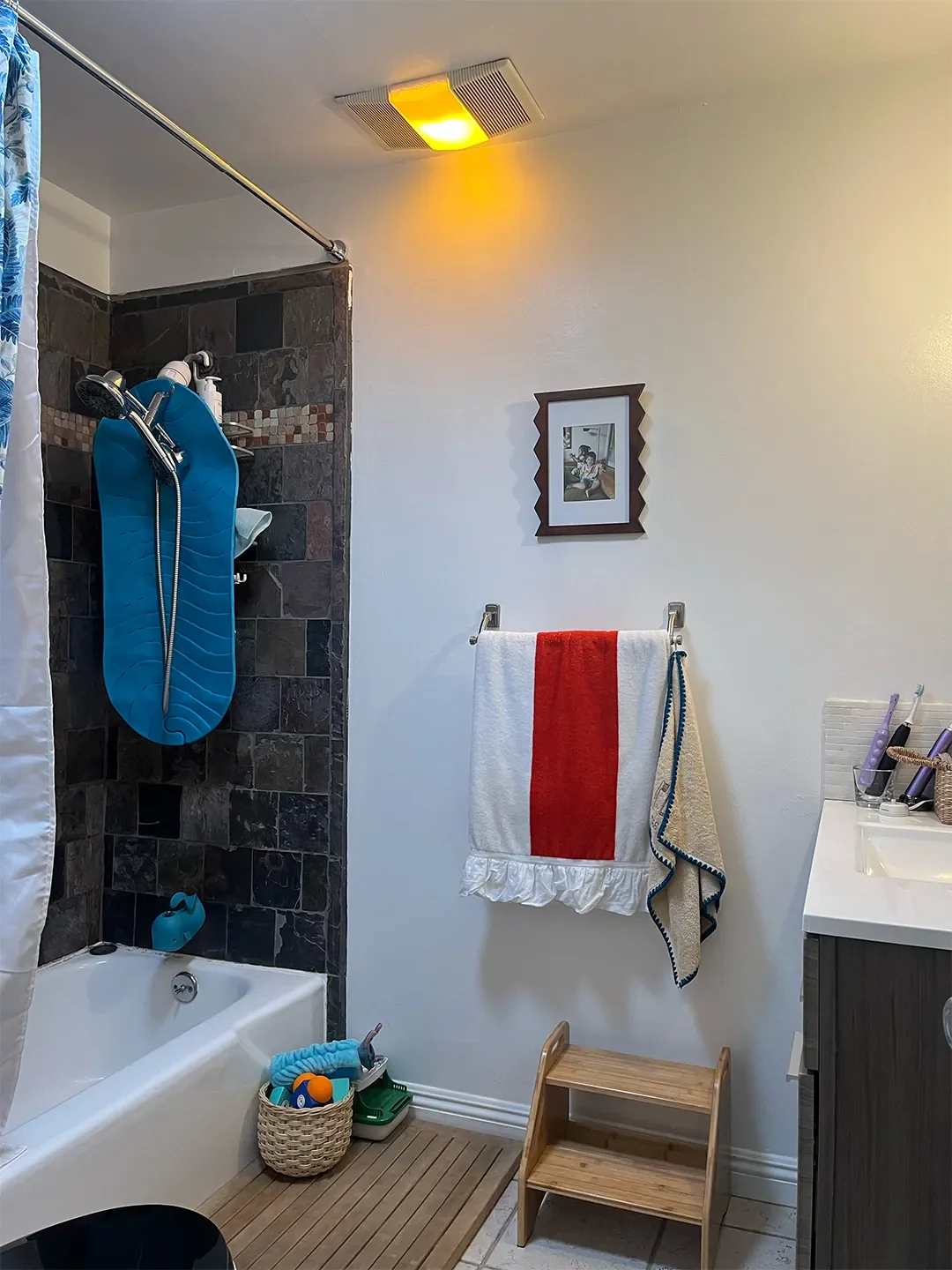 Before & After: Evicting a Cabinet Unlocked This L.A. Bathroom’s Wild Striped Shower Moment
