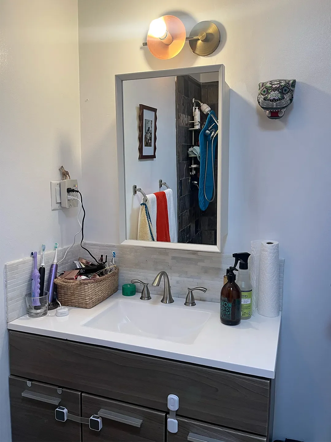 Before & After: Evicting a Cabinet Unlocked This L.A. Bathroom’s Wild Striped Shower Moment